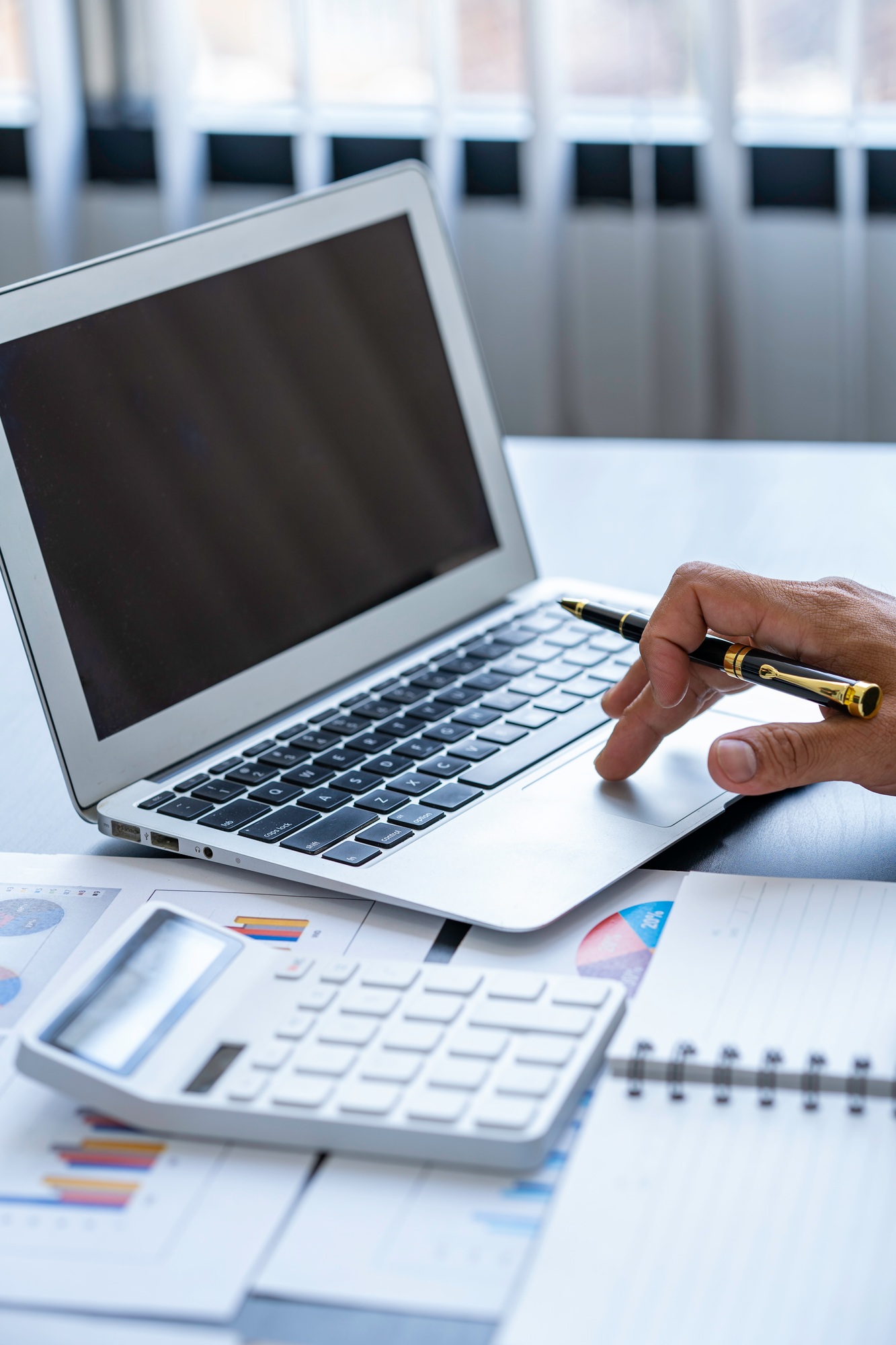 Business man working on laptop computer searching information and planning startup project in office