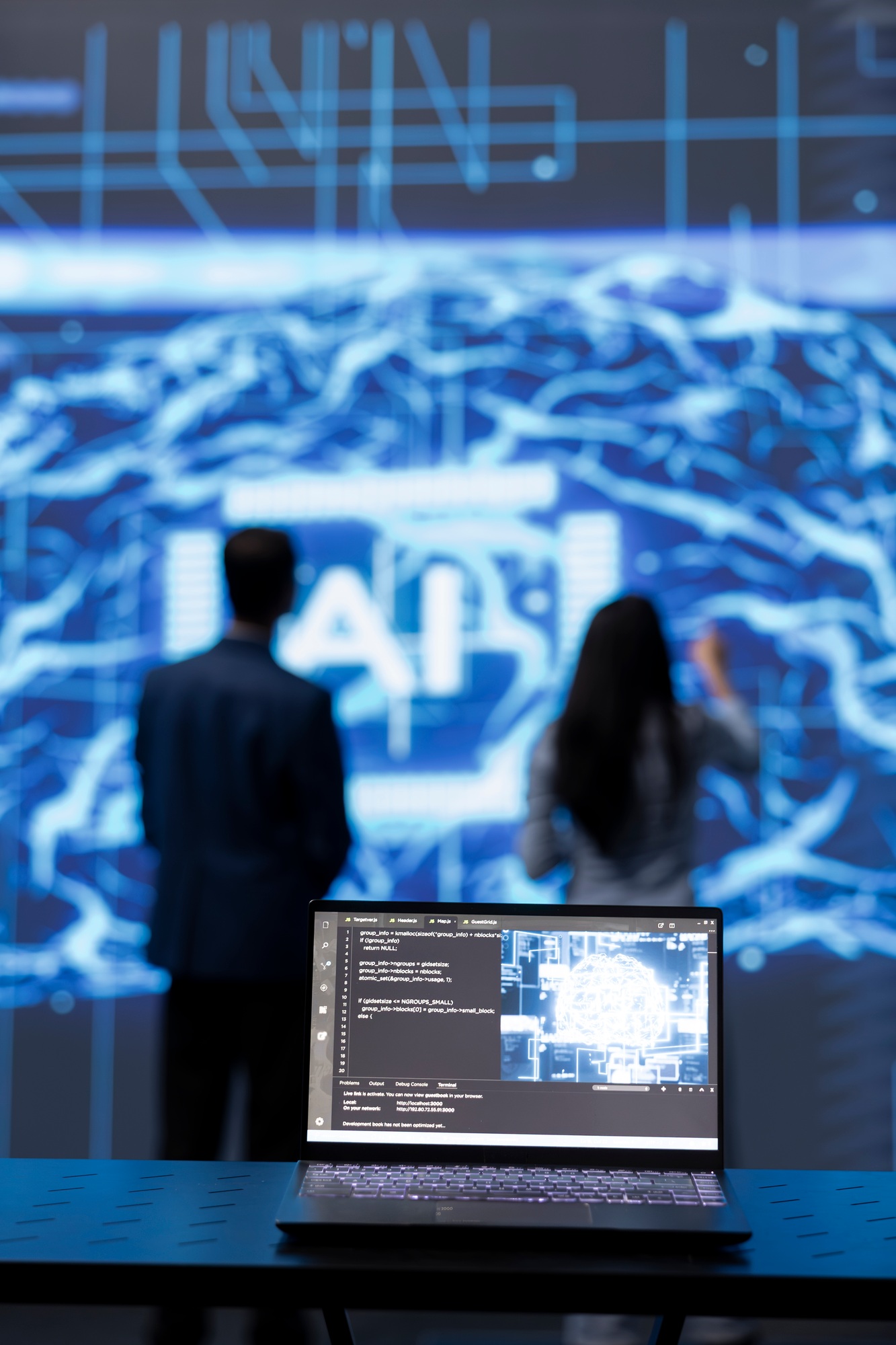 Focus on complex AI brain models being analyzed on laptop by developers